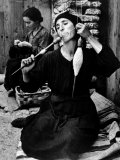 Spanish Peasant Using Ancient Methods to Spin Flax Into Thread