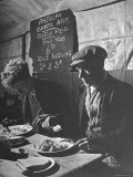 Two Men Eating American Food at a Liverpool Communal Feeding Centre