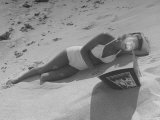 Woman Getting Sun Tan at the Beach