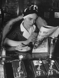 Woman Wearing a Turban While Drinking a Chocolate Shake and Reading the Newspaper