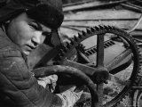 Russian Steel Worker Turning Gear Wheel in a Steel Mill