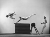 Three Men of Danish Gymnastic Team Performing a Tiger Leap