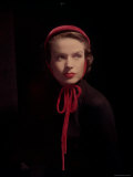 Model Wearing Small Red Velvet Cap Tied under Chin