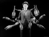 Stroboscopic Image of Juggler Stan Cavenaugh Juggling Tenpins