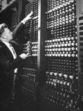 Technician Manipulating 1 of Hundreds of Dials on Panel of IBM's Room Size Eniac Computer