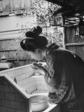 Novice Geisha Washing Her Face at a Basin