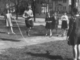 Suzy Creech Standing First in Line with Friends  Typical Girls Known as "Pigtailers" Jumping Rope