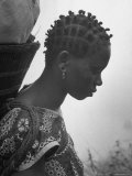 Woman Carrying a Full Basket on Her Back