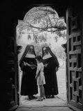 Nuns in Doorway of Chapel at Espada Mission Instructing Local Girl
