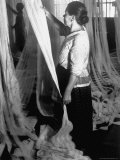Russian Worker Inspecting Lace at Factory