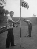 Son Cary Caddying For His Father