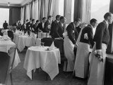Waiters in the Grand Hotel Dining Room Lined Up at Window Watching Sonja Henie Ice Skating Outside
