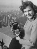 Woman Holding Instant Photo Copies from Her Camera