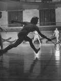 Young People Enjoying a Game of Badminton Inside of a YMCA