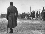 War Veteran Watching Communists Groups Marching Through Streets