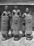 Natives Playing Drums Studded with Shells and Bits of Copper