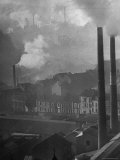 Smoke Stacks Releasing Thick Clouds of Smoke Into the Air
