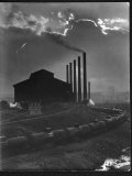 Massive Otis Steel Mill Surrounded by Tanker Cars on Railroad Track on a Cloudy Day