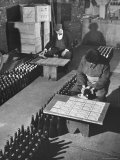 Men Putting Labels on Wine Bottles