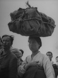Refugees Carrying Possession on Their Heads and Shoulders