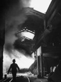 Man Walking in the Smokey Steel Mill