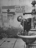 Young Boy Getting a Drink from Fountain in Trieste Region