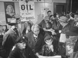 Town Residents Standing in Gas Station  Discussing Problems Caused by Oil Boom