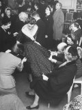 Showroom Taking on Bargain Basement Look as Anxious Buyers Paw over Skirt of Dress