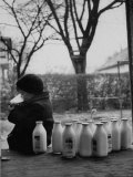 Small Boy Helping Himself to Milk