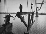 Raising the Truss  Men of the Raising Gang Ride the Swinging Steel 160 Feet Above the Water