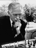 Older Man  with Thoughtful Expression  Playing Chess