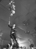 Navy Man on Leave Going After Balloons During the Beaux Arts Ball