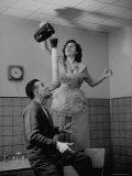 Robert Dotzauer at Breakfast with His Wife Helping Him Improvise a Trick