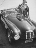 Well Dressed Woman and Her Foreign Made Roadster