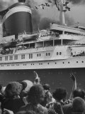 The Ship United States  under Flags  Going on First Trip  with Passengers Waving to Those on Shore