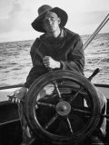 Newport Bermuda Sailing Race: Young Man Attending the Wheel of a Sailboat