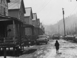 Small Girl Walking Down the Poverty Stricken Town of Hemphill in Appalachia