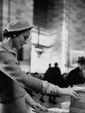 Model Posing in a Train Station in a Tweed Suit