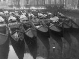 Moored Gondolas in Canal That Runs Between Ancient Buildings of the City