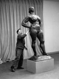 People Looking at a Sculpture by Artist Gaston Lachaise at an Art Show of American Art in France