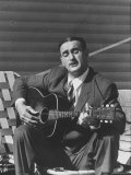 Miner Maurice Ruddick Playing Guitar