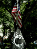 American Flag Hanging Above a Pow-Mia Flag in a Park in New York