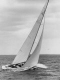 The Two Sail Sailboat Vigorously Gliding Through the Water During the America's Cup Trail