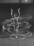 Multiple Exposure of a Woman Playing with a Hula Hoop