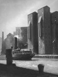 Ship Passing Grain Elevators on Waterway