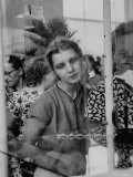 Wistful Russian Girl Eyeing a Rhinestone Bracelet at a Display of British Fashions