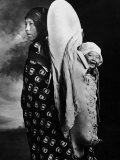 Native American Mother and Her Baby  Happily Hanging on Her Back in Glacier Park