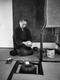 Old Monk Sitting in Cell Meditating and Performing Tea Ceremony