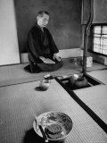 Old Monk Sitting in Cell Meditating and Performing Tea Ceremony