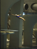 Athlete in Mid Air During a Platform Dive at Summer Olympics